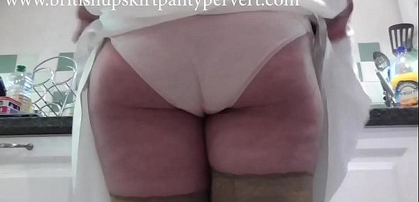  British mature wife and mother Rosemary gives upskirt panty views before swallowing a huge load of spunk in her own kitchen